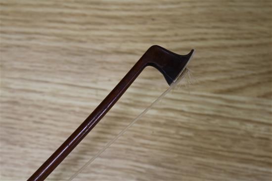 A silver mounted violin bow, an ivory mounted violin bow and a late 19th century German violin, cased